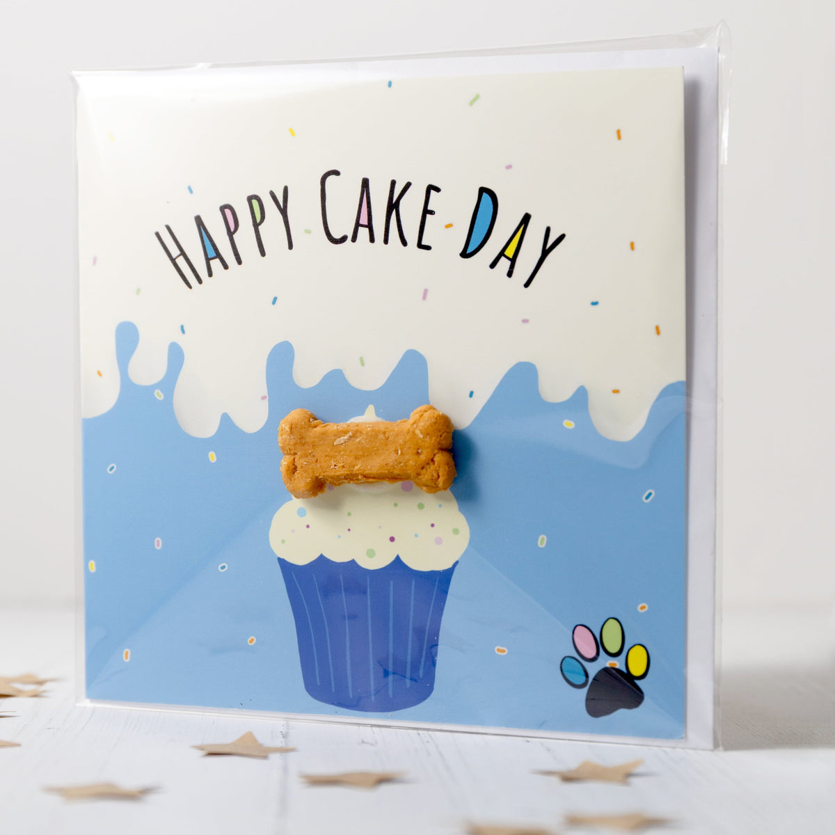 Greeting card with a cupcake illustration and 'Happy Cake Day' text on a white background.