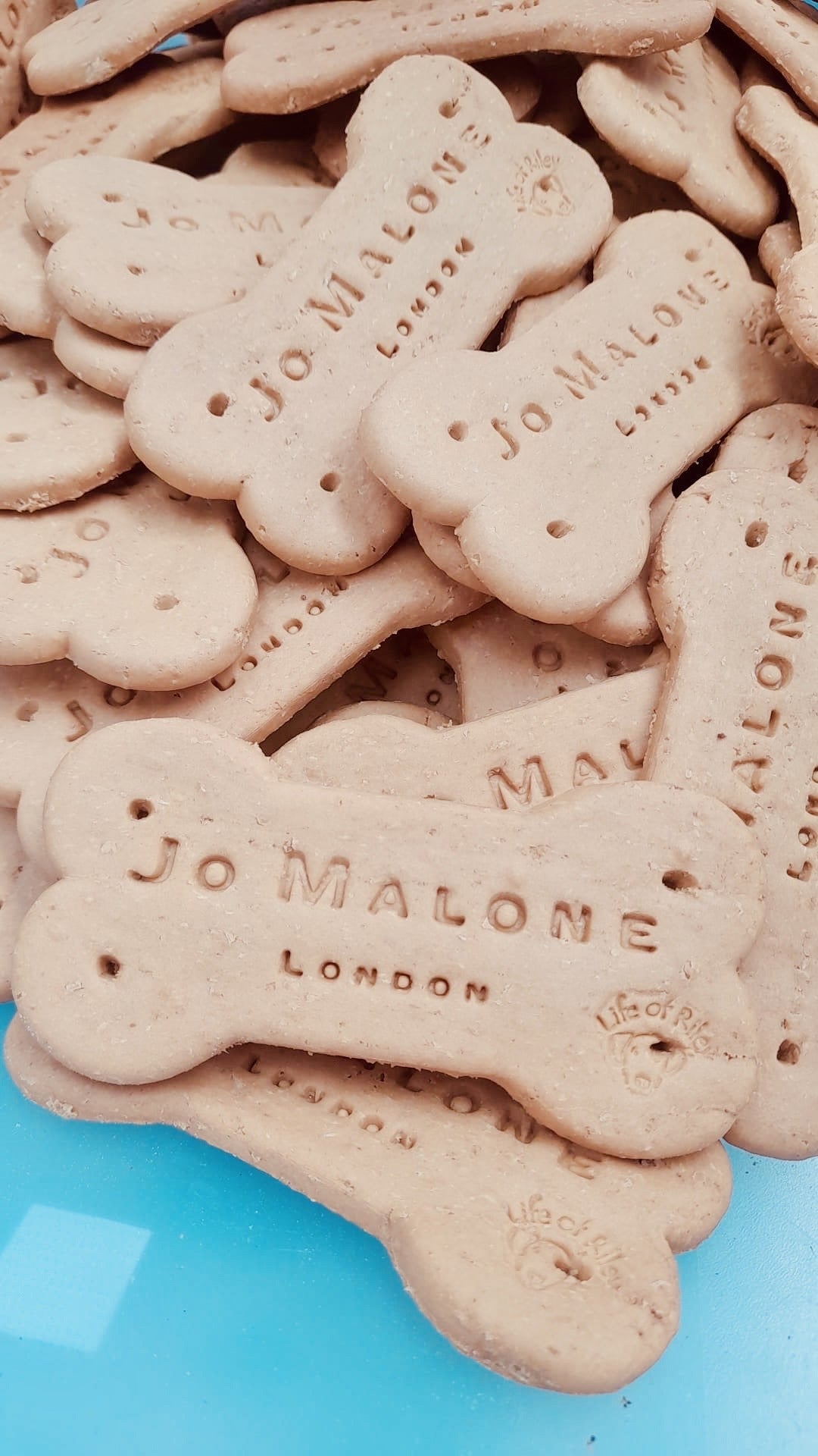 Custom branded bone shaped dog biscuit stamped with a company logo